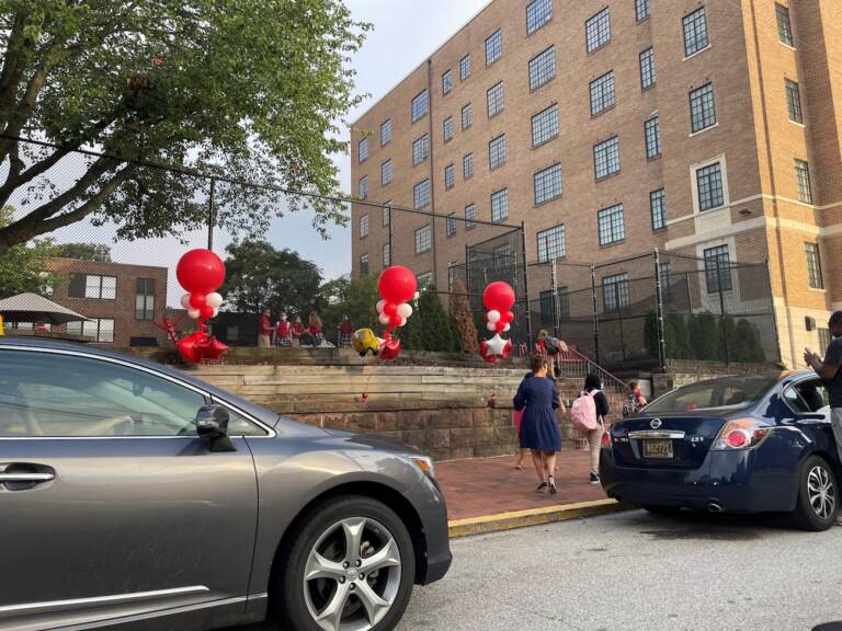 Students in Delaware are returning to fully open schools this week, like these kids heading into Ursuline Academy in Wilmington. (Cris Barrish/WHYY)