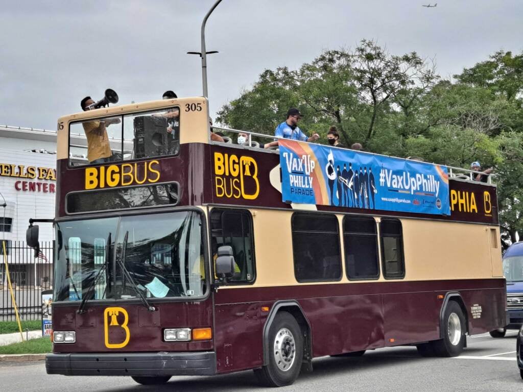 The Vax Up Philly bus travels down a city street