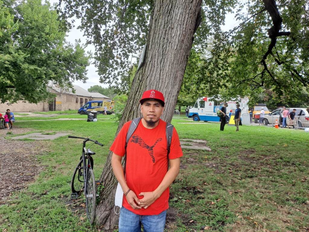 Arturo Juarez stands in front of a tree