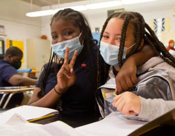 E.W. Rhodes 6th grade students London Wesley (left) and Saminh Wheeler (right) are new friends who bonded over their love of cats. (Kimberly Paynter/WHYY)