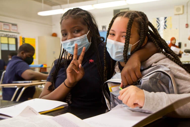 E.W. Rhodes 6th grade students London Wesley (left) and Saminh Wheeler (right) are new friends who bonded over their love of cats. (Kimberly Paynter/WHYY)