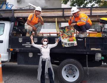 Charito Calvachi-Mateyko, who participated in Tuesday’s march in Washington, posed with two unidentified workers that day