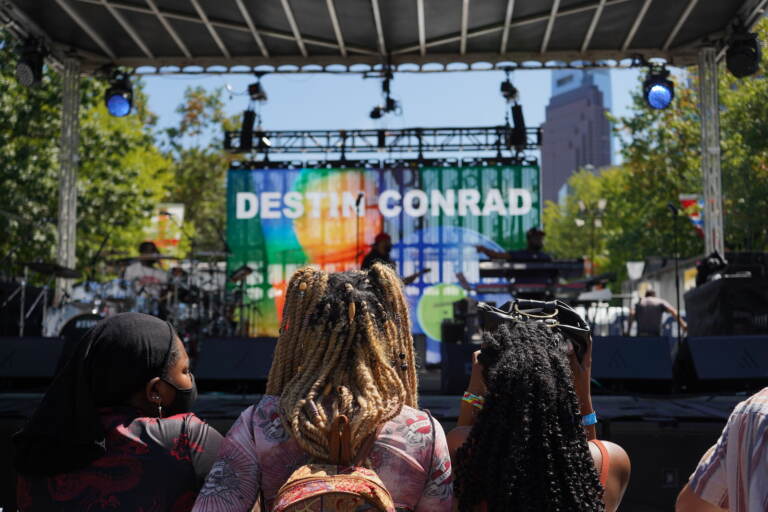 A band rehearses in front of a few early arrivals at the 2021 Made in America festival