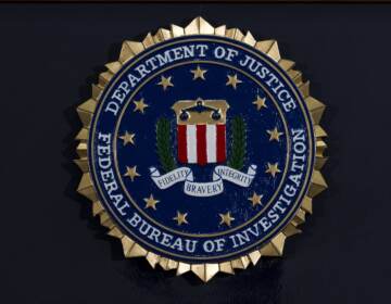 FILE PHOTO: The FBI seal is seen before a news conference at FBI headquarters in Washington on June 14, 2018. (Jose Luis Magana / AP Photo)