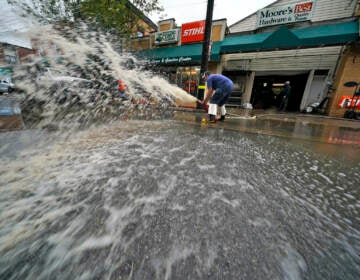 Water is pumped from the basement of a business on Noblestown road in Oakdale, Pa. during clean up from flooding after downpours and high winds from the remnants of Hurricane Ida, hit the area Wednesday, Sept. 1, 2021