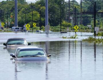 Vehicles are under water during flooding in Norristown