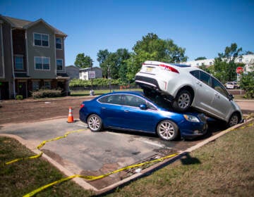 Cars are pilled after flooding as a result of the remnants of Hurricane Ida at Oakwood Plaza Apartments complex in Elizabeth, NJ., Thursday, Sept. 2, 2021. (AP Photo/Eduardo Munoz Alvarez)