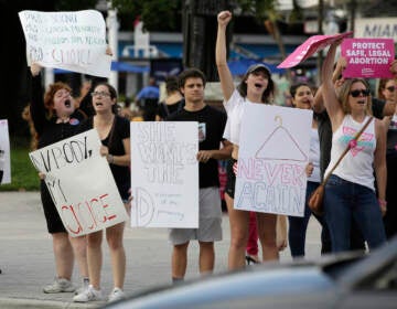 Demonstrators chant slogans during a rally