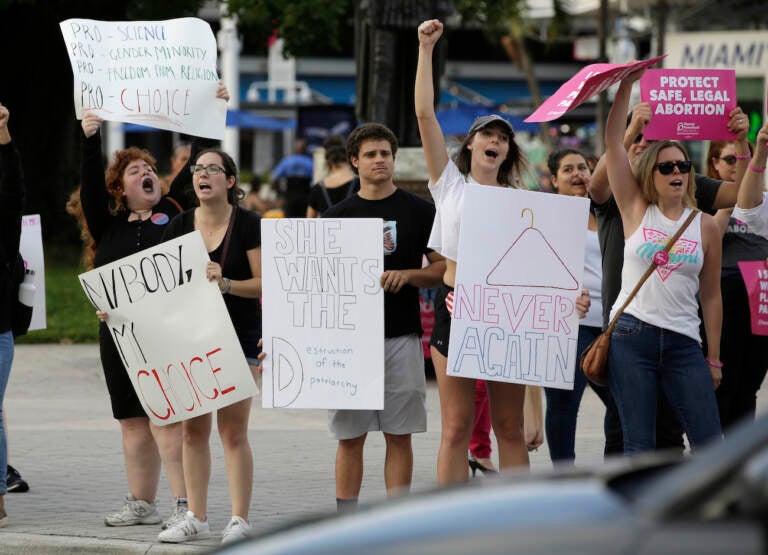 Demonstrators chant slogans during a rally