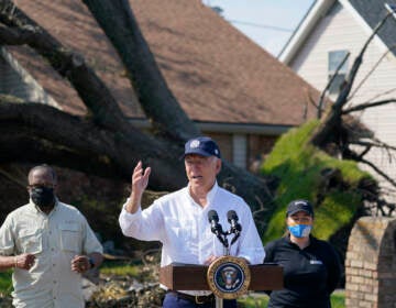 President Joe Biden talks as he tours a neighborhood impacted by Hurricane Ida, Friday, Sept. 3, 2021, in LaPlace, La.
