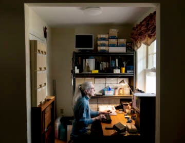 Woman poses at computer