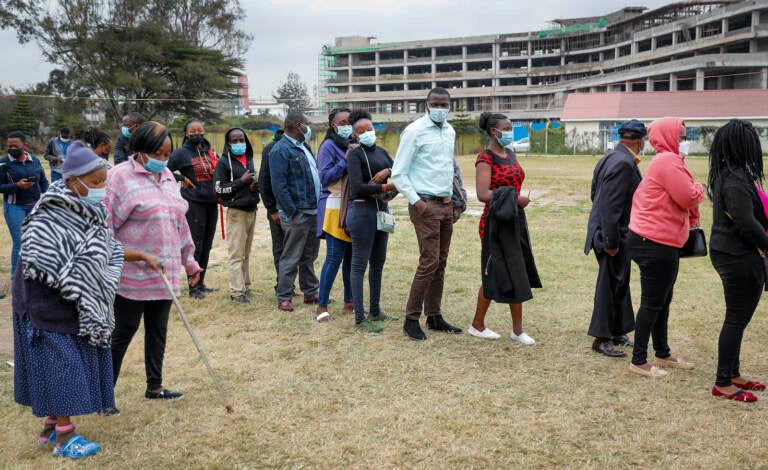 Kenyans queue up to receive the AstraZeneca coronavirus vaccine, at Kenyatta National Hospital in Nairobi, Kenya Thursday, Aug. 26, 2021