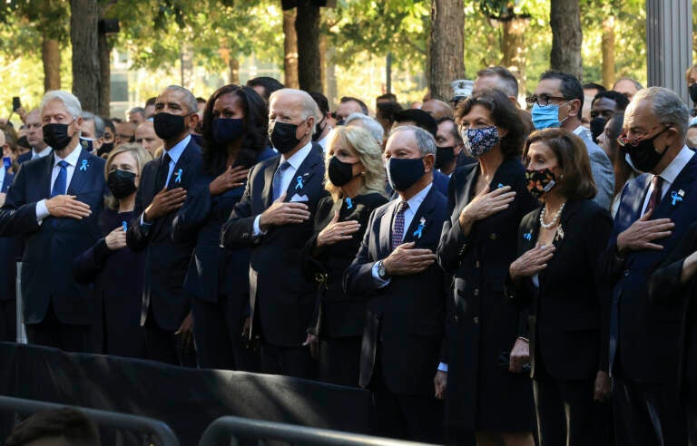 From left, former President Bill Clinton, former First Lady Hillary Clinton, former President Barack Obama, former First Lady Michelle Obama, President Joe Biden, First Lady Jill Biden, former New York City Mayor Michael Bloomberg, Bloomberg's partner Diana Taylor, Speaker of the House Nancy Pelosi (D-CA) and Senate Minority Leader Charles Schumer (D-NY) stand for the national anthem during the annual 9/11 Commemoration Ceremony at the National 9/11 Memorial and Museum on Saturday, Sept. 11, 2021 in New York