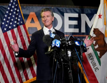 California Gov. Gavin Newsom addresses reporters after beating back the recall attempt that aimed to remove him from office, at the John L. Burton California Democratic Party headquarters in Sacramento, Calif., Tuesday, Sept. 14, 2021. (AP Photo/Rich Pedroncelli)