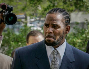 FILE - This photo from Friday May 9, 2008, shows R. Kelly arriving for the first day of jury selection in his child pornography trial at the Cook County Criminal Courthouse in Chicago. R. Kelly, the R&B superstar known for his anthem “I Believe I Can Fly,” was convicted Monday in a sex trafficking trial after decades of avoiding criminal responsibility for numerous allegations of misconduct with young women and children.  (AP Photo/Charles Rex Arbogast, File)