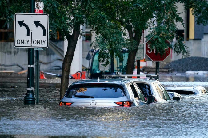 Cars are seen in a flooded area of Philly