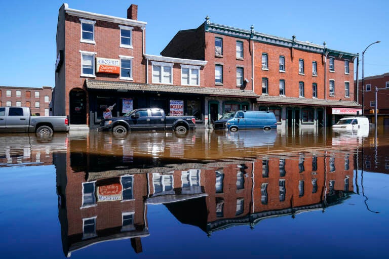 Vehicles are under water during flooding on Main Street in Norristown