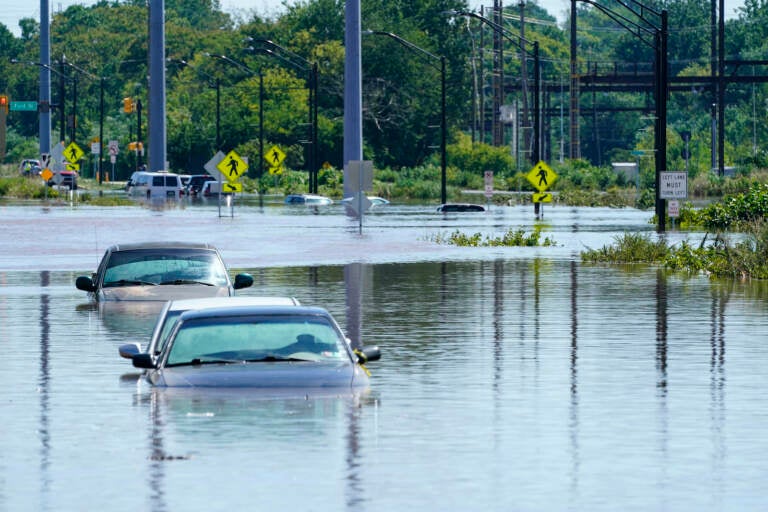 Vehicles are under water during flooding in Norristown