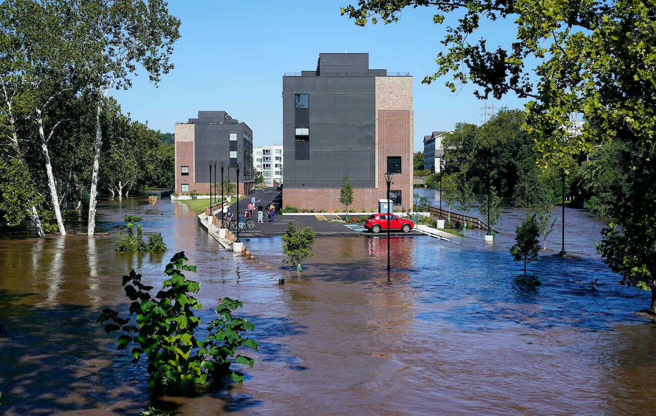 A residential building is surrounded by the floodwaters from the Schuylkill River