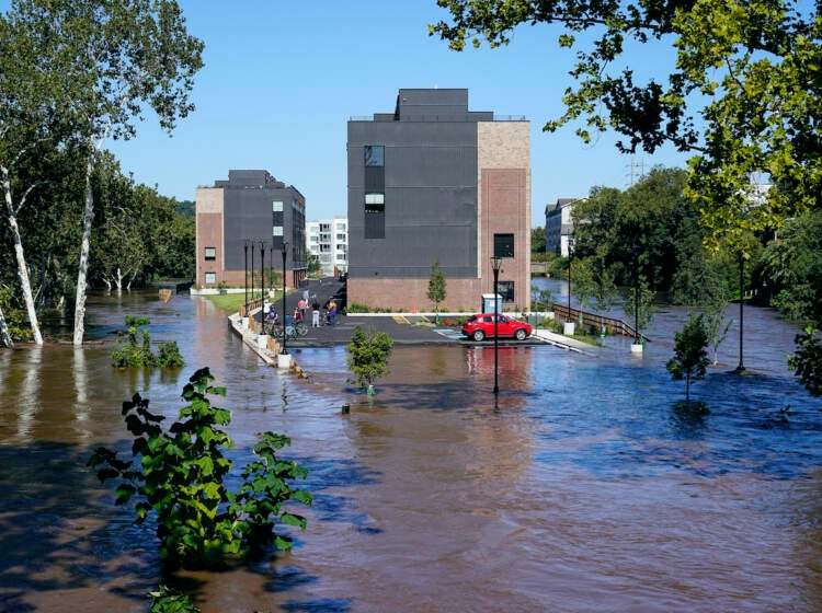 A residential building is surrounded by the floodwaters from the Schuylkill River