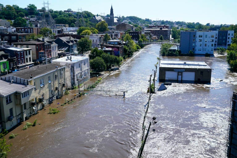 The Schuylkill River exceeds its bank in the Manayunk sectio