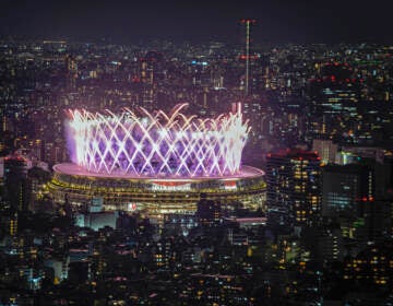 Fireworks illuminate over National Stadium viewed from Shibuya Sky observation deck