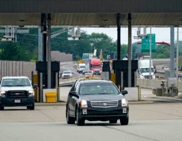 Traffic going eastbound on the Pennsylvania Turnpike proceeds through the electronic toll booths