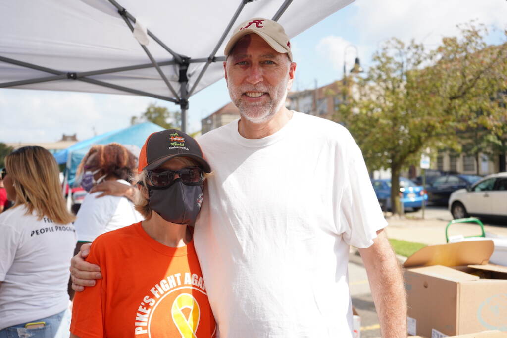 Cathy Fortune (L), cheif clerk at the Public Defender's Office and Greg Nester (R), the county's co-chief Public Defender, helped unpackage the food