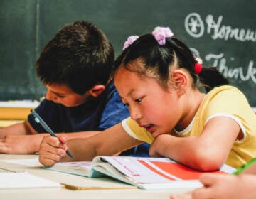 A young girl and young boy in school