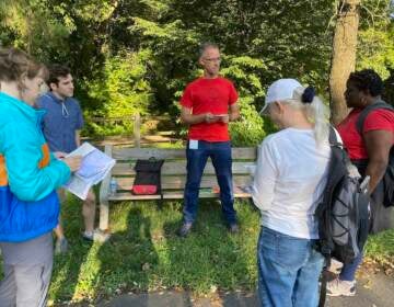 Artist JJ Tizou leads a walking tour around Philadelphia. (Aaron Moselle / WHYY)