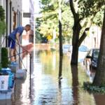 Water rises on Race Street near the Schuylkill River. (Emma Lee/WHYY)
