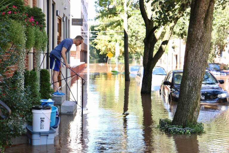 Water rises on Race Street near the Schuylkill River.