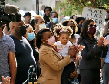 A crowd gathers outside Chester police headquarters, where the family of Bahir Green held a press conference to demand answers about the 16-year-old’s arrest. A video appeared to show Chester police beating the boy after he surrendered. (Emma Lee/WHYY)