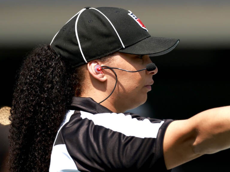 Line judge Maia Chaka #100 signals during the game between the Carolina Panthers and the New York Jets at Bank of America Stadium on September 12, 2021 in Charlotte, North Carolina. (Photo by Grant Halverson/Getty Images)