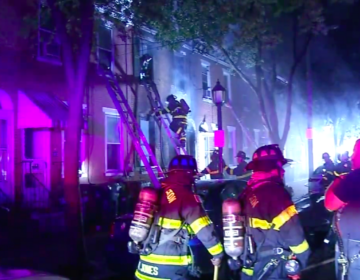 Fire crews at a rowhome fire that broke out in Wilmington, Del. (6abc)