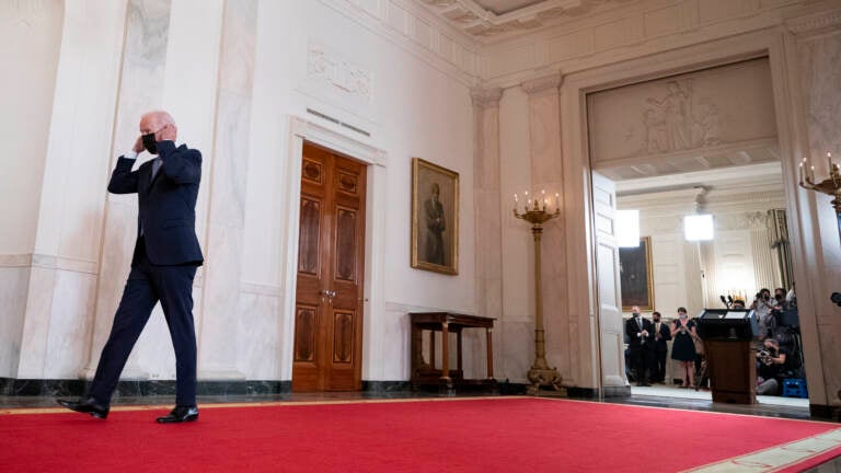 President Biden walks from the podium in the White House