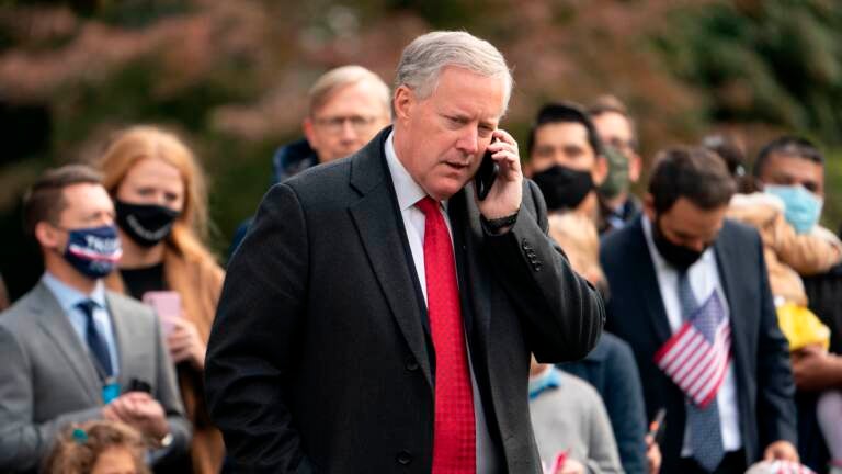 White House Chief of Staff Mark Meadows speaks on his phone as he waits for US President Donald Trump to depart the White House on October 30, 2020 in Washington, D.C.