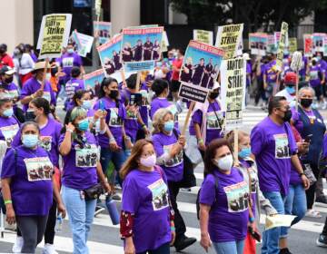 More than 1,000 janitors with the Service Employees International Union rally and march
