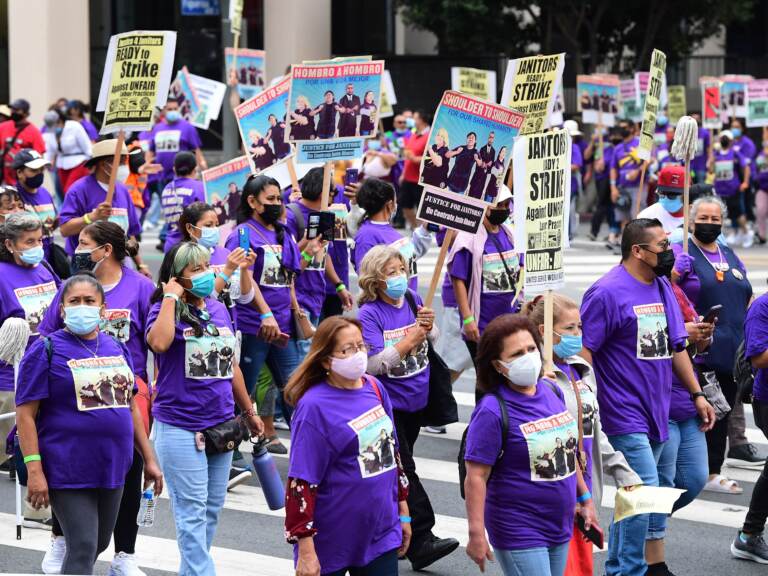 More than 1,000 janitors with the Service Employees International Union rally and march