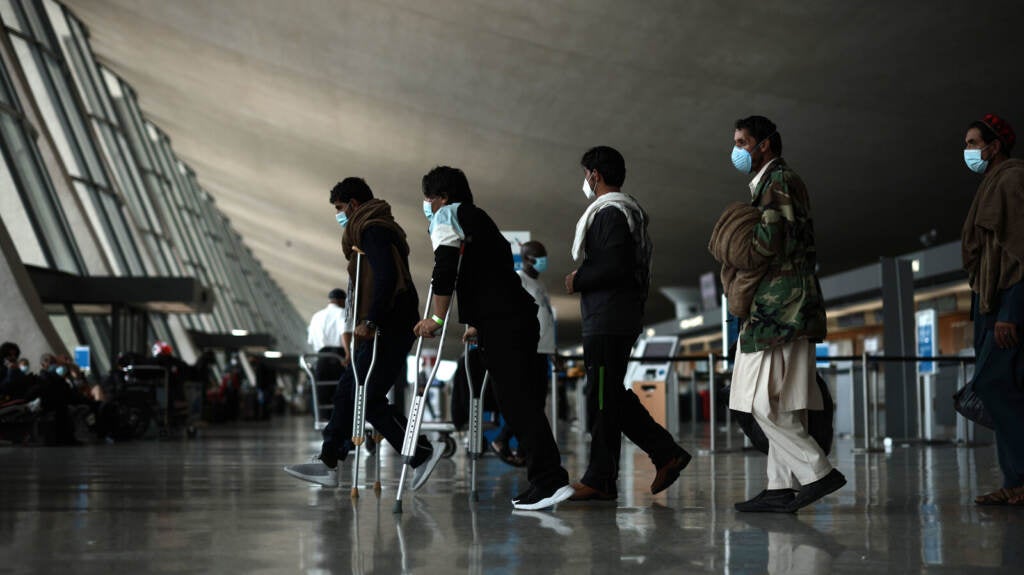 Refugees are seen at Dulles International Airport