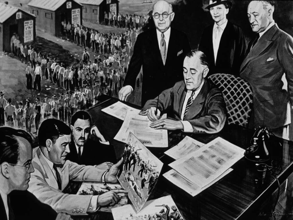 President Franklin D. Roosevelt signs the National Labor Relations Act