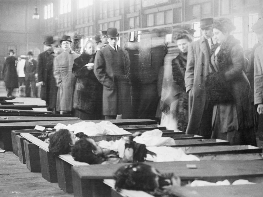 Family members arrive at the New York City morgue to identify the bodies of victims of the Triangle Shirtwaist Company Fire
