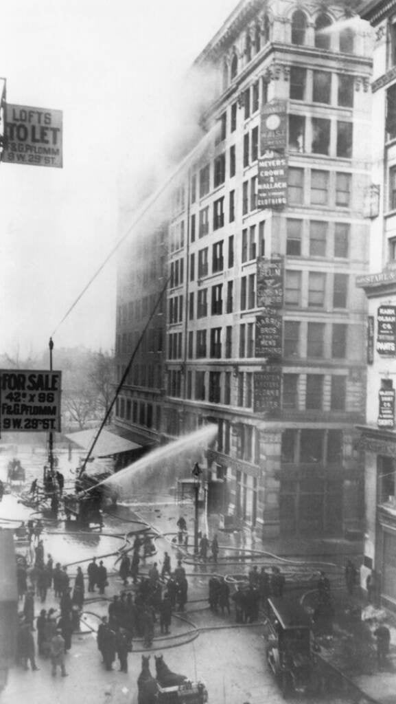 Fire fighters try to put out the 1911 fire at the Triangle Shirtwaist Factory Building