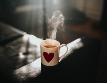 Steam is seen coming off of a hot cup of tea