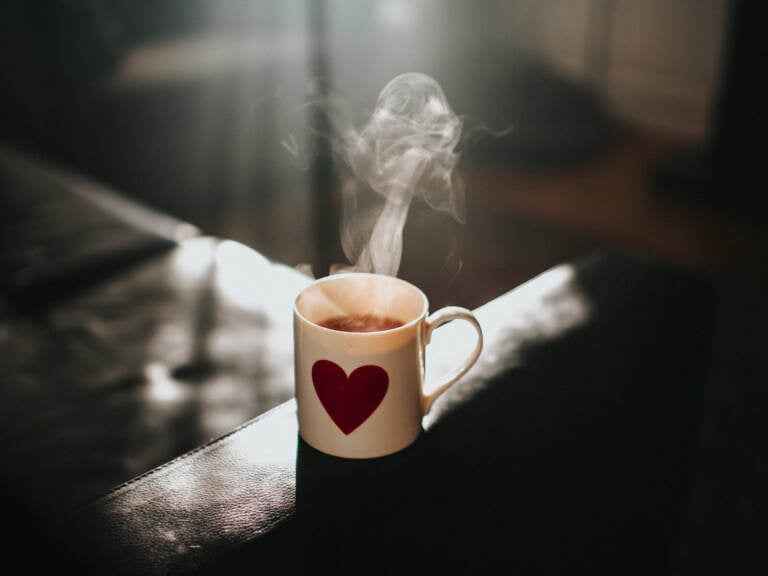 Steam is seen coming off of a hot cup of tea