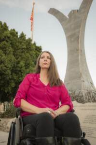 Jennifer Longdon sits in a wheelchair outside