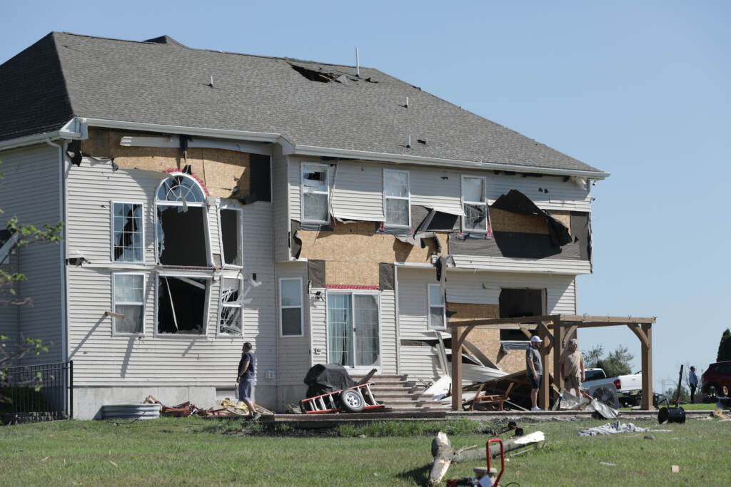 A home is seen with major damage in Mullica Hill