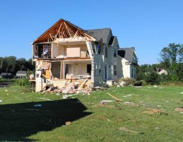 A home is seen with major damage in Mullica Hill