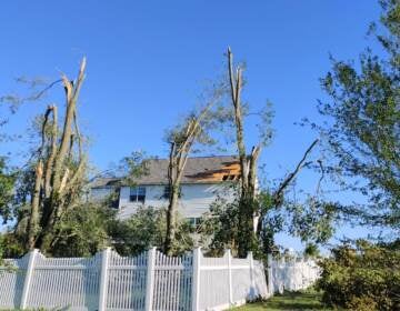 A home is seen with major damage in Mullica Hill