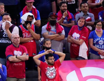 Philadelphia 76ers' fans watch the final minutes of Game 7 in a second-round NBA basketball playoff series against the Atlanta Hawks, Sunday, June 20, 2021, in Philadelphia. (AP Photo/Matt Slocum)